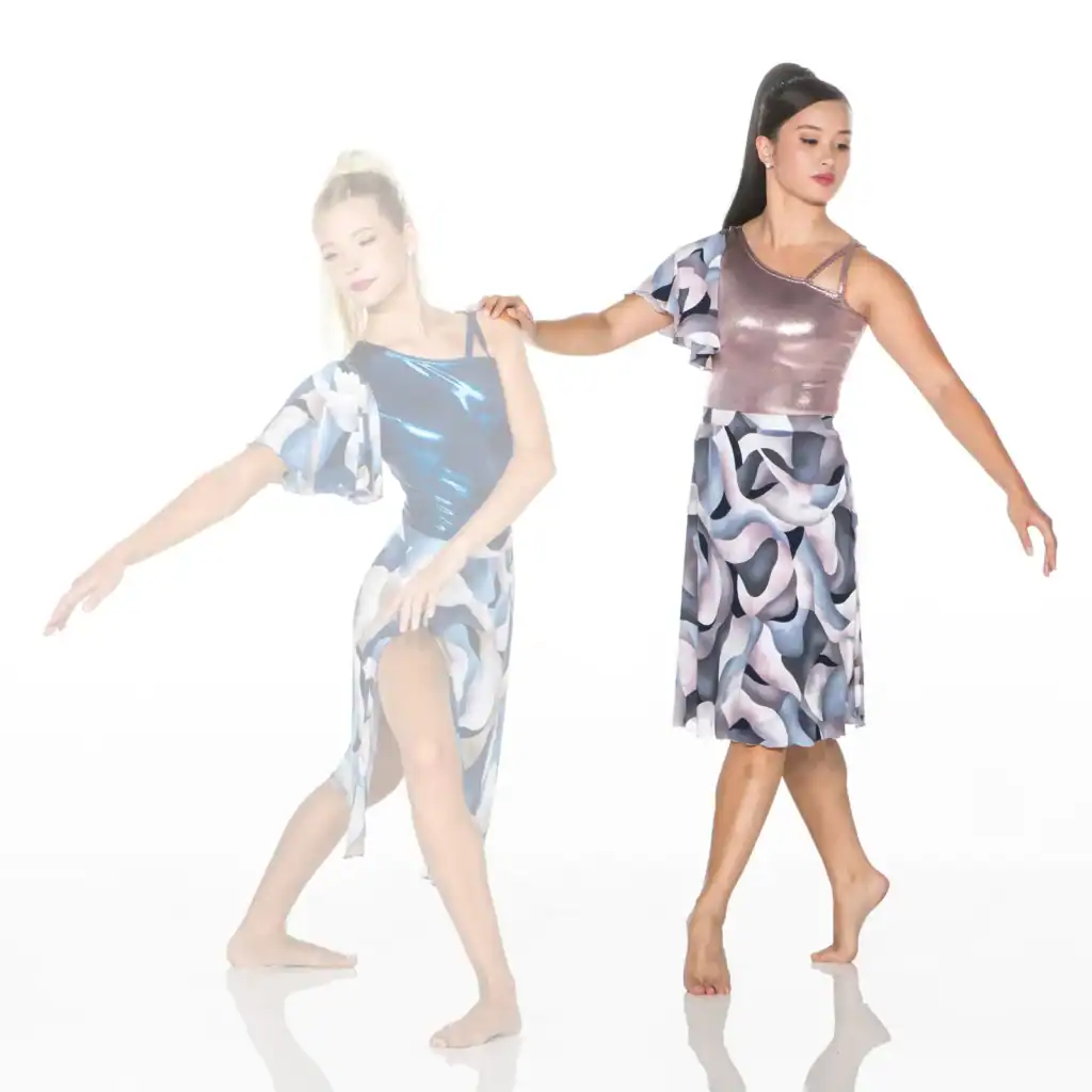 Two barefoot dancers in patterned costumes posing against white background