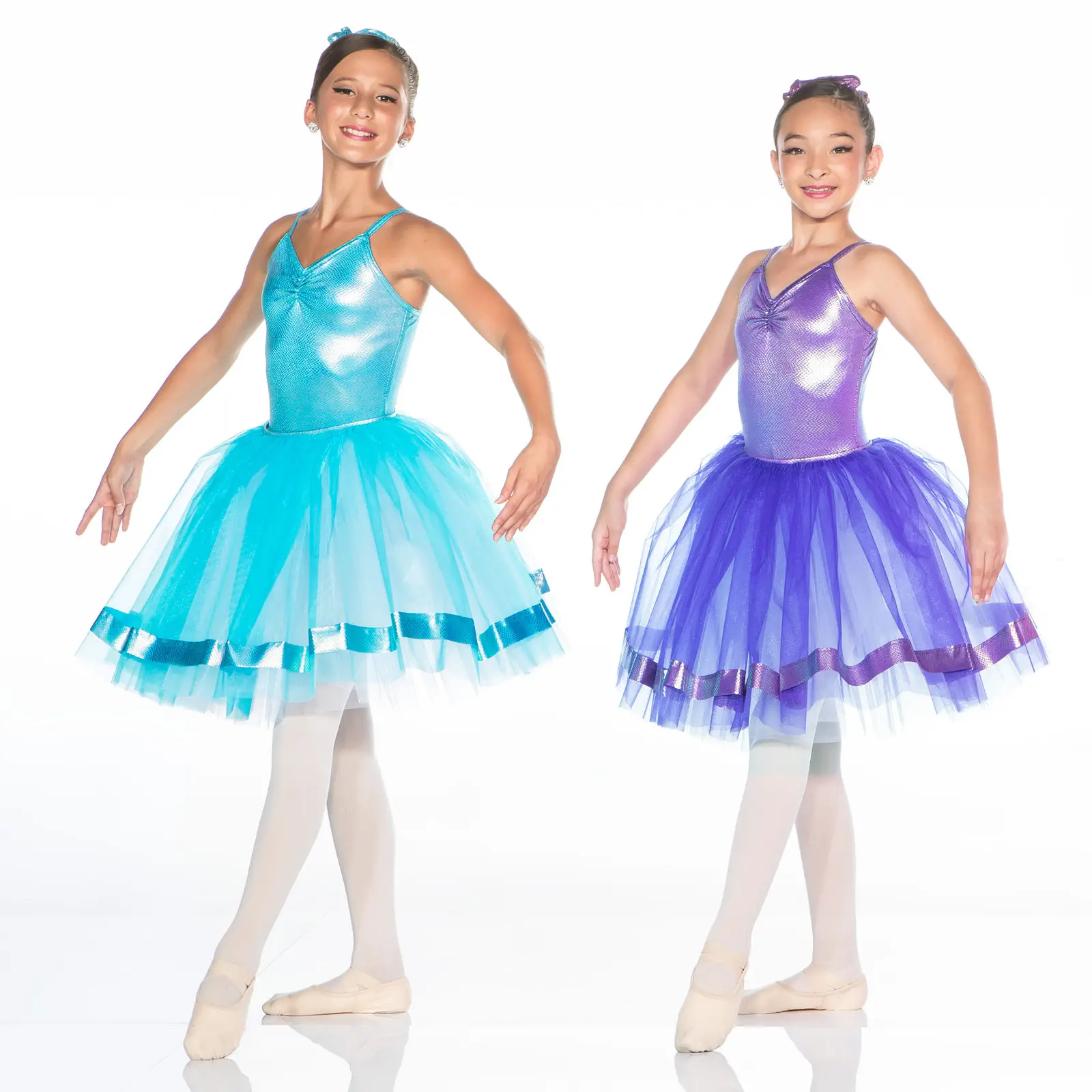 Two young ballet dancers in turquoise and purple tutus