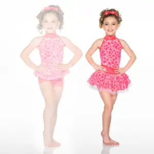 Girl modeling pink heart-print dance costume with skirt